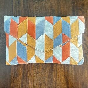 Multicolored leather clutch with a unique design #clutchbag